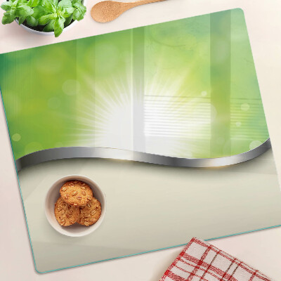 Tábua para corte Bokeh verde com raios de luz