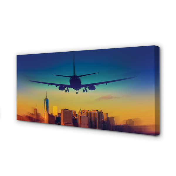 Pintura em tela Cidade nuvens avião pôr do sol