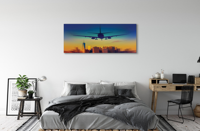 Pintura em tela Cidade nuvens avião pôr do sol