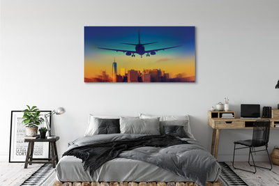 Pintura em tela Cidade nuvens avião pôr do sol