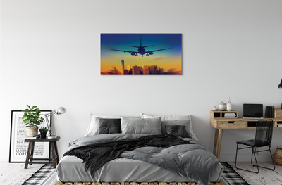Pintura em tela Cidade nuvens avião pôr do sol