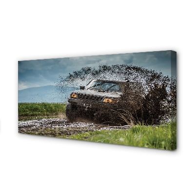 Quadro em tela Veículo off-road montanhas nuvens