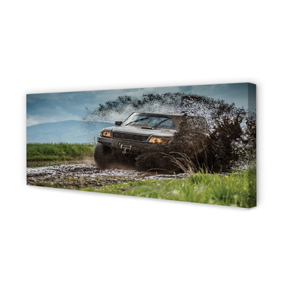 Quadro em tela Veículo off-road montanhas nuvens