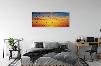 Pintura em tela Pássaros em cordas ao pôr do sol