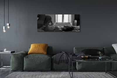 Quadro em tela Uma mulher deitada e olhando pela janela