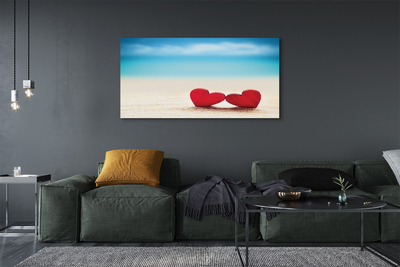 Quadro em tela Corações de areia vermelha do mar