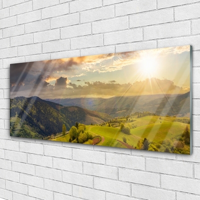 Quadro de vidro Pôr do sol no prado das montanhas