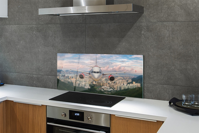 Painel de vidro avião cidade montanhas