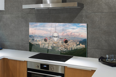 Painel de vidro avião cidade montanhas