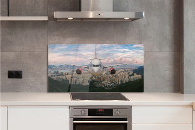 Painel de vidro avião cidade montanhas