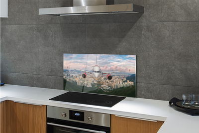 Painel de vidro avião cidade montanhas