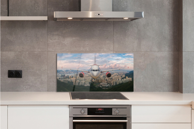 Painel de vidro avião cidade montanhas