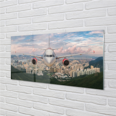 Painel de vidro avião cidade montanhas