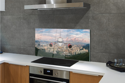 Painel de vidro avião cidade montanhas