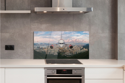 Painel de vidro avião cidade montanhas