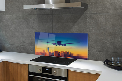 Painel de vidro Cidade nuvens avião pôr do sol