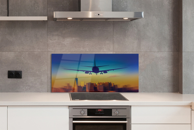 Painel de vidro Cidade nuvens avião pôr do sol