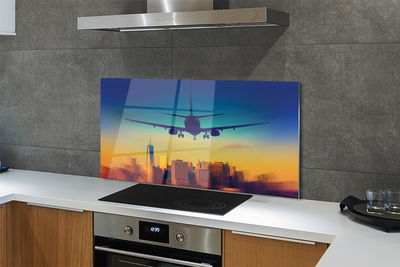 Painel de vidro Cidade nuvens avião pôr do sol