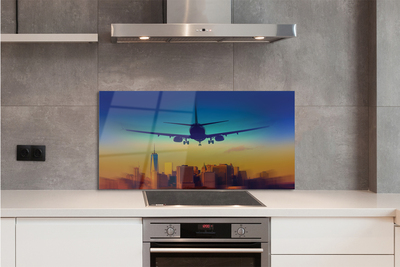 Painel de vidro Cidade nuvens avião pôr do sol