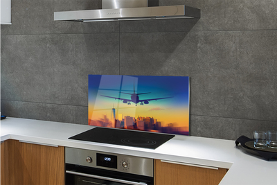 Painel de vidro Cidade nuvens avião pôr do sol