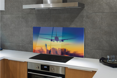 Painel de vidro Cidade nuvens avião pôr do sol