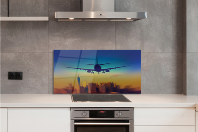 Painel de vidro Cidade nuvens avião pôr do sol