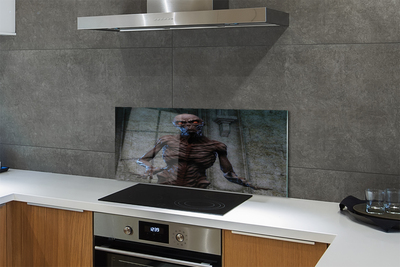 Painel de vidro Uma figura assustadora no prédio