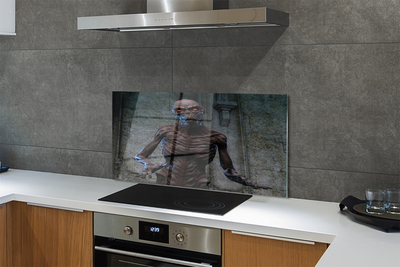 Painel de vidro Uma figura assustadora no prédio