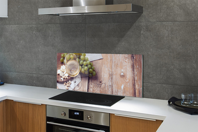 Painel de vidro Um copo de nozes e uvas