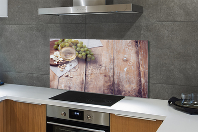 Painel de vidro Um copo de nozes e uvas