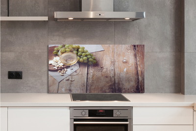 Painel de vidro Um copo de nozes e uvas