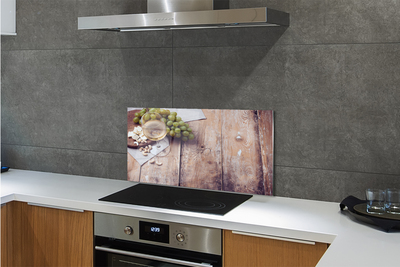 Painel de vidro Um copo de nozes e uvas