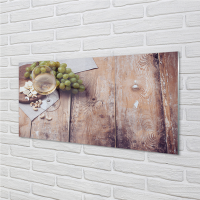 Painel de vidro Um copo de nozes e uvas