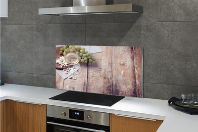 Painel de vidro Um copo de nozes e uvas