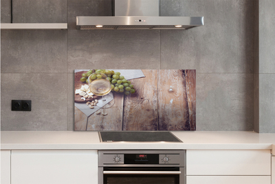 Painel de vidro Um copo de nozes e uvas