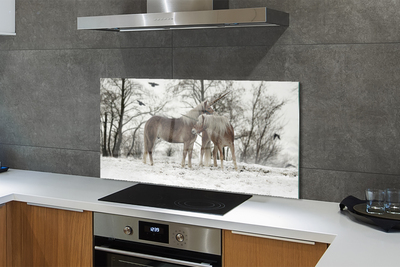 Painel de vidro Unicórnios da floresta de inverno