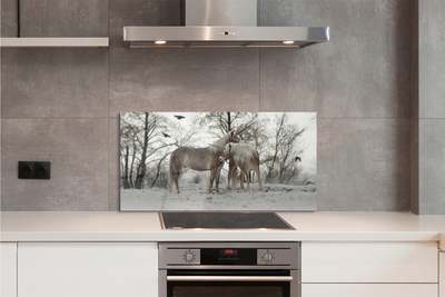 Painel de vidro Unicórnios da floresta de inverno