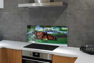 Painel de vidro Borboleta em uma flor
