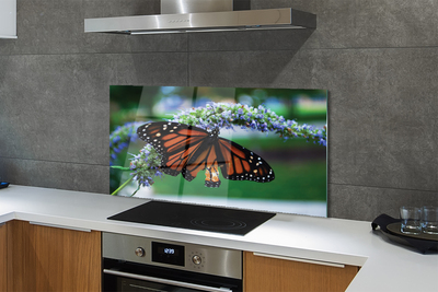 Painel de vidro Borboleta em uma flor