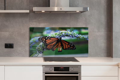 Painel de vidro Borboleta em uma flor