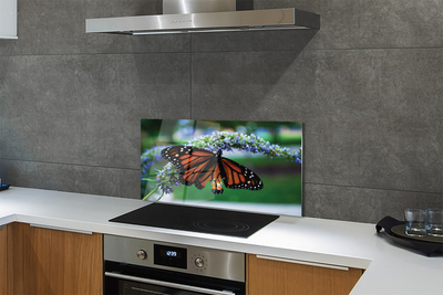 Painel de vidro Borboleta em uma flor