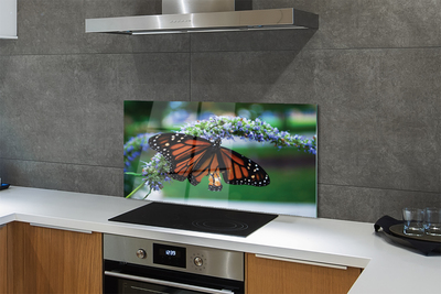 Painel de vidro Borboleta em uma flor