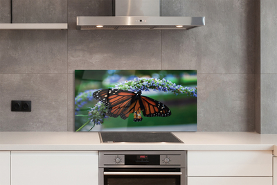 Painel de vidro Borboleta em uma flor