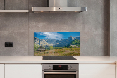 Painel de vidro Montanhas, campos, casas