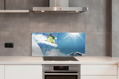 Painel de vidro Homem de snowboard nas montanhas