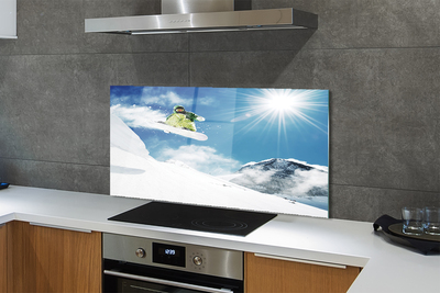 Painel de vidro Homem de snowboard nas montanhas