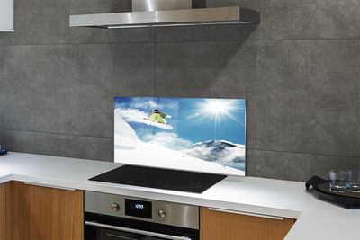 Painel de vidro Homem de snowboard nas montanhas