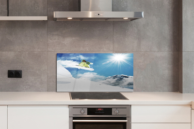 Painel de vidro Homem de snowboard nas montanhas