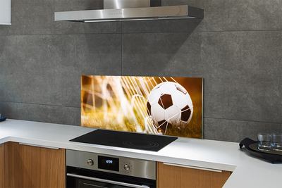 Painel de vidro Bola amarela em fundo de grama