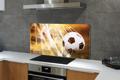 Painel de vidro Bola amarela em fundo de grama